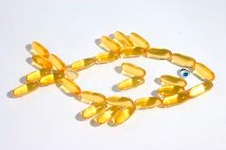 Omega-3 capsules arranged in the shape of a fish