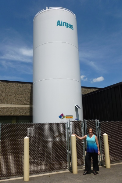 How Cord Blood Banks Protect their Storage Tanks: Dr. Verter standing next to a reserve liquid nitrogen tank