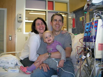 photo of Kacey Rose receiving her cord blood transplant, held by her parents